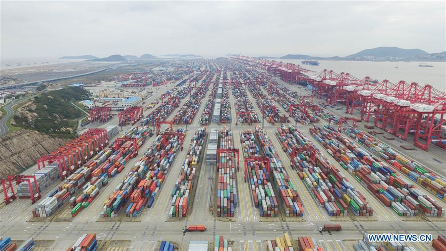 An aerial photo taken on Dec. 8, 2015 shows the Yangshan Port Container Terminal in Shanghai, east China. The throughput of the Yangshan Port Container Terminal has ranked top for consecutive five years in the world and it is designed to expand its throughput capacity to 40 million TEU (20-foot equivalent unit) by 2017. (Xinhua/Ding Ting) 