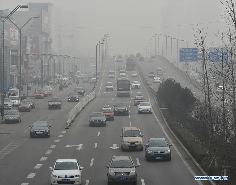 Photo taken on Dec. 10, 2015 shows the downtown area is shrouded in smog in Taiyuan, north China's Shanxi Province.