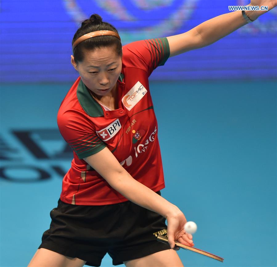 Portugal's Fu Yu returns a shot against China's Ding Ning during their women's singles match of the 2015 ITTF World Tour Grand Finals in Odivelas, outskirts of Lisbon on Dec. 11, 2015. 