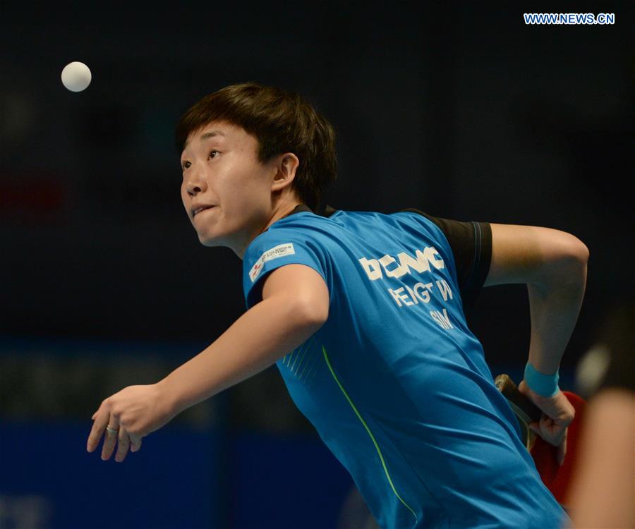 Singpore's Feng Tianwei returns a shot against China's Zhu Yuling during their women's singles match of the 2015 ITTF World Tour Grand Finals in Odivelas, outskirts of Lisbon on Dec. 11, 2015. 