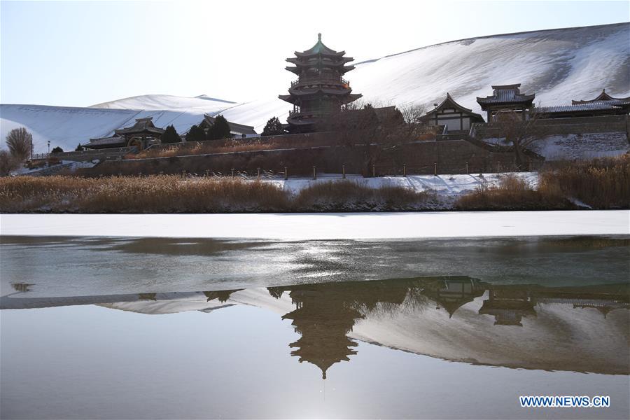 Photo taken on Dec. 13, 2015 shows the scenery at the Crescent Lake scenery spot in Mingsha Mountain of Dunhuang City, northwest China's Gansu Province.