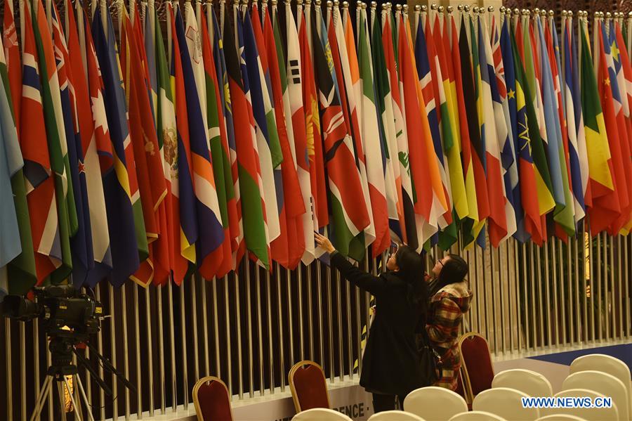 Staff workers make arrangements at the conference hall for the second World Internet Conference in Wuzhen, east China's Zhejiang Province, Dec. 14, 2015.