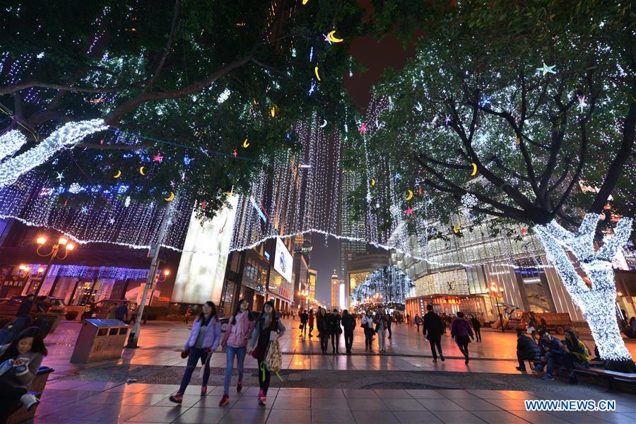 Photo taken on Dec. 23, 2015 shows the neon lights on a pedestrian street in Chongqing, southwest China. 