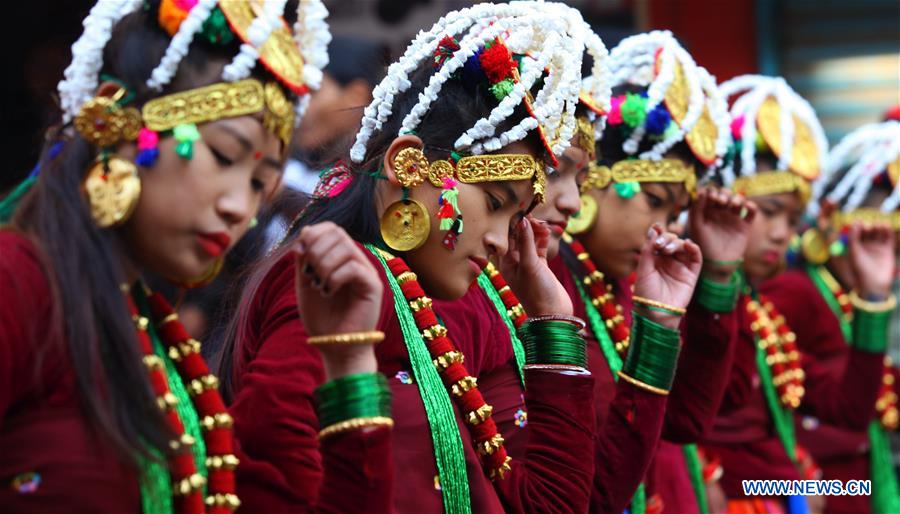 A man from ethnic Gurung community fires a bow during celebrations for the Tamu Losar (New Year) festival in Kathmandu, Nepal, Dec. 30, 2015. 