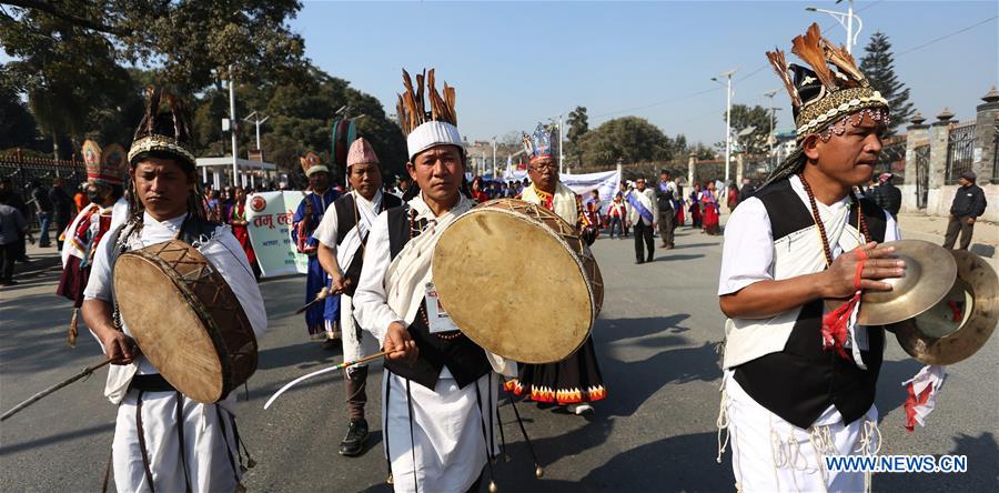 A man from ethnic Gurung community fires a bow during celebrations for the Tamu Losar (New Year) festival in Kathmandu, Nepal, Dec. 30, 2015. 