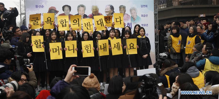 People hold portraits of deceased former South Korean 'comfort women' during a weekly anti-Japan protest in front of the Japanese embassy in Seoul, South Korea, Dec. 30, 2015. 