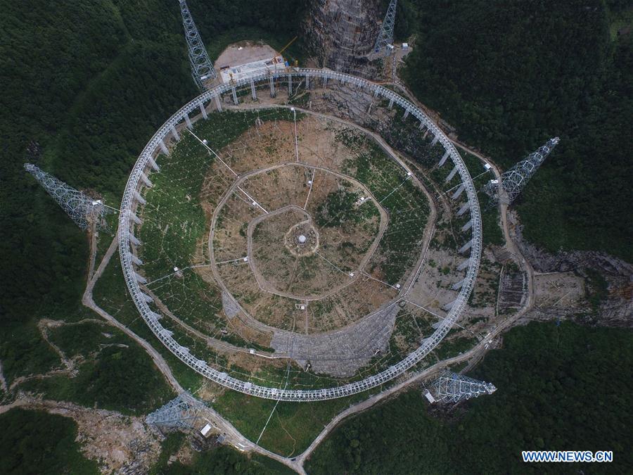 Photo taken on Aug. 2, 2015 shows an aerial view of the assembly site of the single-aperture spherical telescope 'FAST' in Qiannan of southwest China's Guizhou Province.