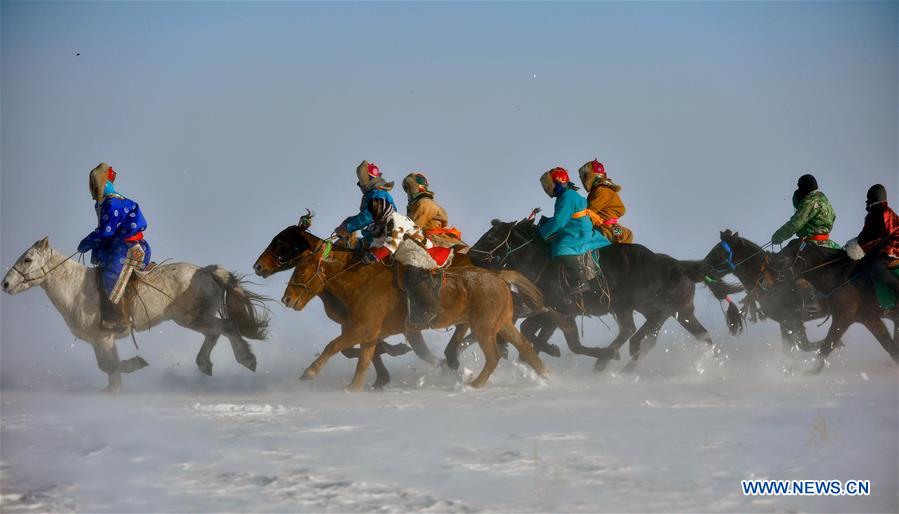 WEST UJIMQIN BANNER, Jan. 5, 2016 (Xinhua) -- Herdsmen race horses in West Ujimqin Banner, north China's Inner Mongolia Autonomous Region, Jan. 5, 2016. (Xinhua/Ren Junchuan)