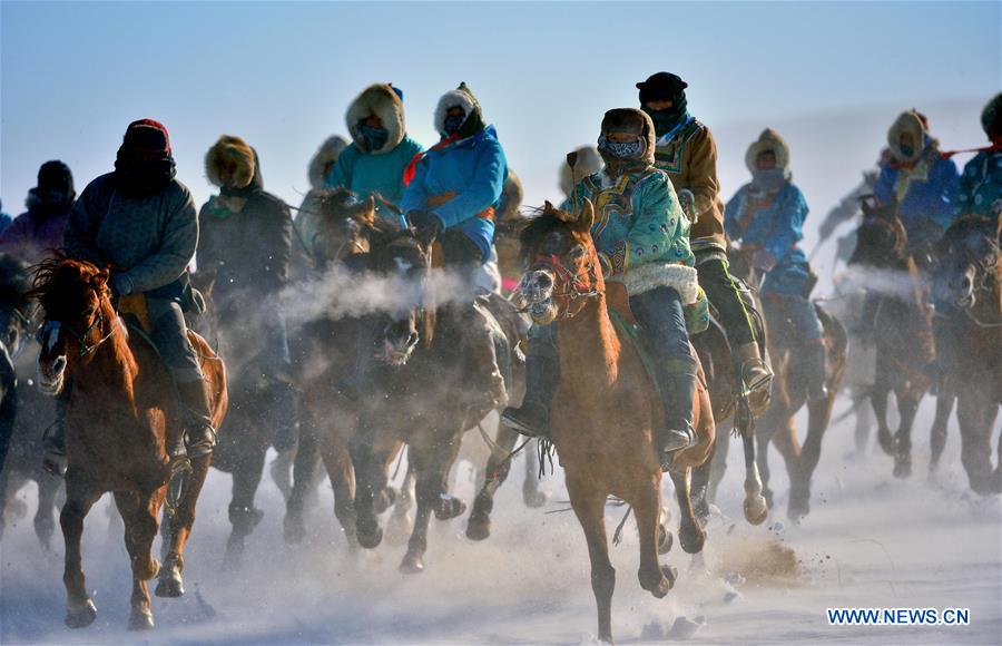 WEST UJIMQIN BANNER, Jan. 5, 2016 (Xinhua) -- Herdsmen race horses in West Ujimqin Banner, north China's Inner Mongolia Autonomous Region, Jan. 5, 2016. (Xinhua/Ren Junchuan)