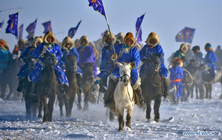 WEST UJIMQIN BANNER, Jan. 5, 2016 (Xinhua) -- Herdsmen riding horses take part in an opening ceremony of horse folk culture in West Ujimqin Banner, north China's Inner Mongolia Autonomous Region, Jan. 5, 2016. (Xinhua/Ren Junchuan)