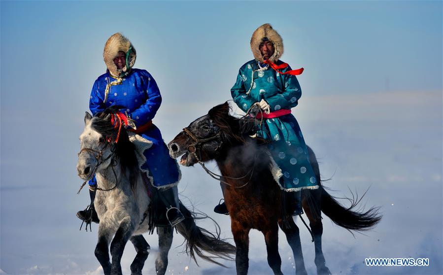 WEST UJIMQIN BANNER, Jan. 5, 2016 (Xinhua) -- Herdsmen ride horses in West Ujimqin Banner, north China's Inner Mongolia Autonomous Region, Jan. 5, 2016. (Xinhua/Ren Junchuan)