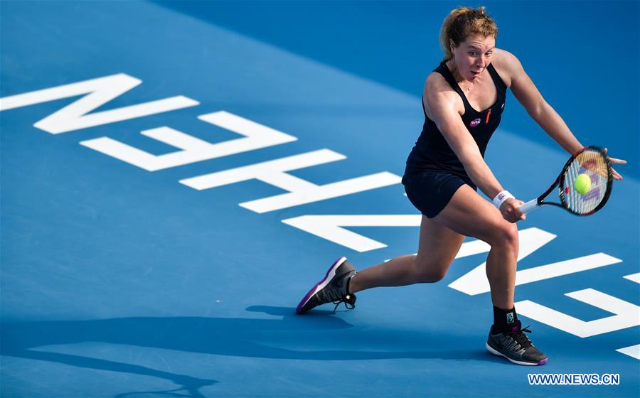 Anna-Lena Friedsam of Germany hits a return against Agnieszka Radwanska of Poland during the semifinal of the 2016 WTA Shenzhen Open Tennis Tournament in Shenzhen, south China's Guangdong Province, Jan. 8, 2016.