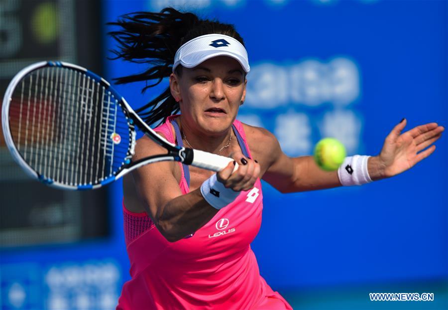  Agnieszka Radwanska of Poland hits a return against Anna-Lena Friedsam of Germany during the semifinal of the 2016 WTA Shenzhen Open Tennis Tournament in Shenzhen, south China's Guangdong Province, Jan. 8, 2016. 