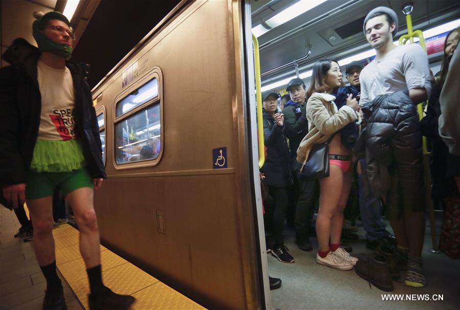 People take part in the 'No Pants Subway Ride' event in Vancouver, Canada, Jan. 10, 2016. 