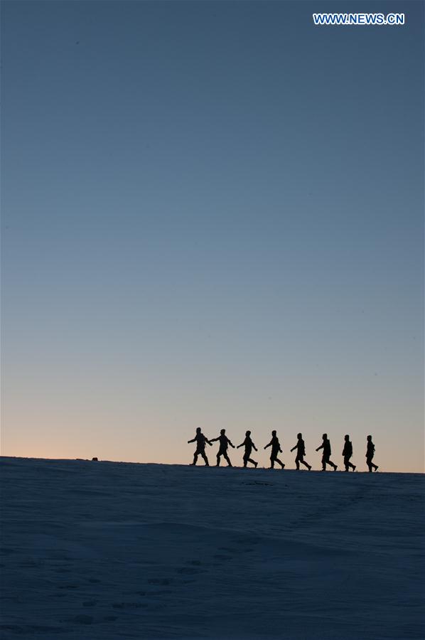 Frontier soldiers patrol under cold weather in Darhan Muminggan United Banner of Baotou City, north China's Inner Mongolia Autonomous Region, Jan. 12, 2016.