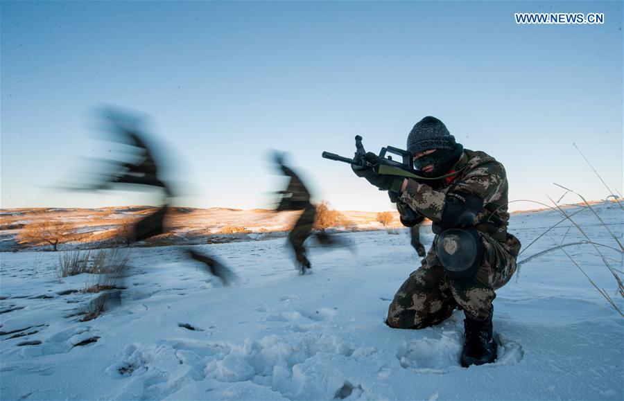 Frontier soldiers take part in a drill under cold weather in Darhan Muminggan United Banner of Baotou City, north China's Inner Mongolia Autonomous Region, Jan. 12, 2016. 