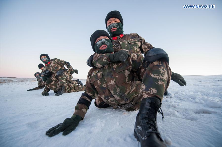 Frontier soldiers take part in a training under cold weather in Darhan Muminggan United Banner of Baotou City, north China's Inner Mongolia Autonomous Region, Jan. 12, 2016.