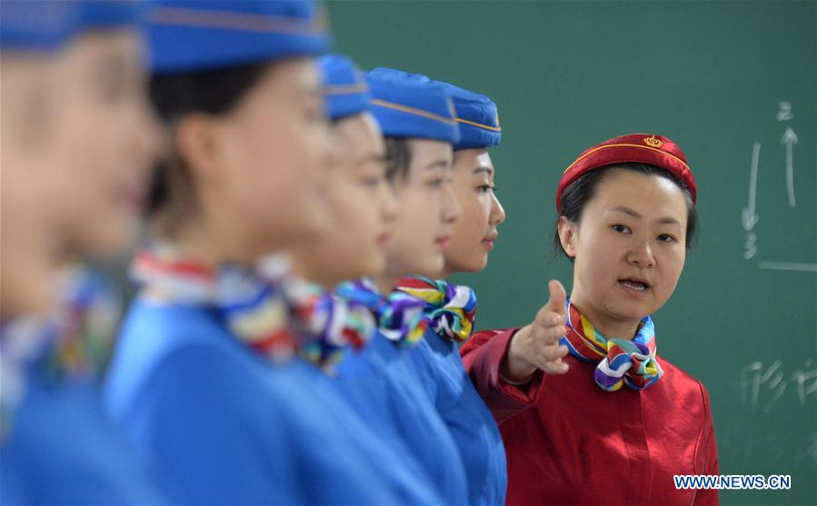 Students exercise in posture training at Bishan Vocational Education Center in Chongqing, southwest China, Jan. 13, 2016.