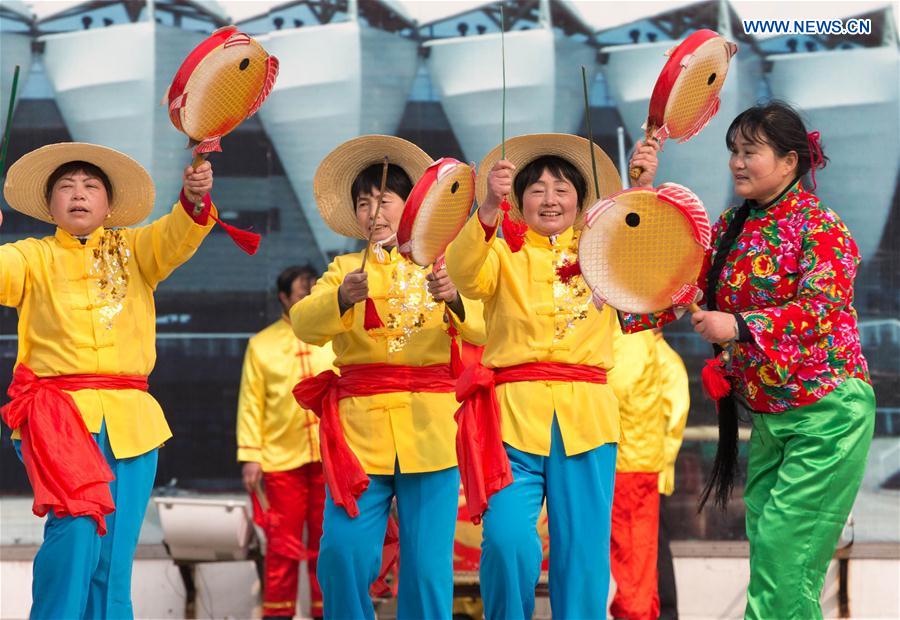 People perform at a square in Xuyi County, east China's Jiangsu Province, Jan. 14, 2016.