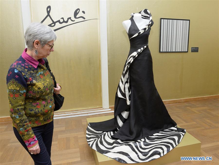 Visitors look at artworks during the opening ceremony of the Moving Eye Exhibition at the Museum of Arts and Crafts in Zagreb, Croatia, Jan. 14, 2016. 