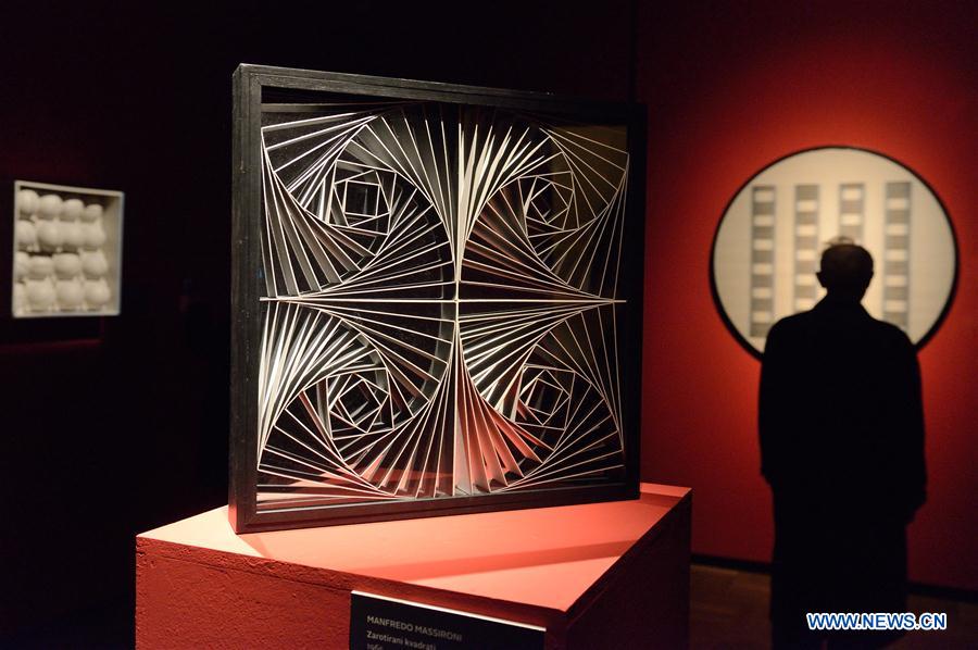 Visitors look at artworks during the opening ceremony of the Moving Eye Exhibition at the Museum of Arts and Crafts in Zagreb, Croatia, Jan. 14, 2016.