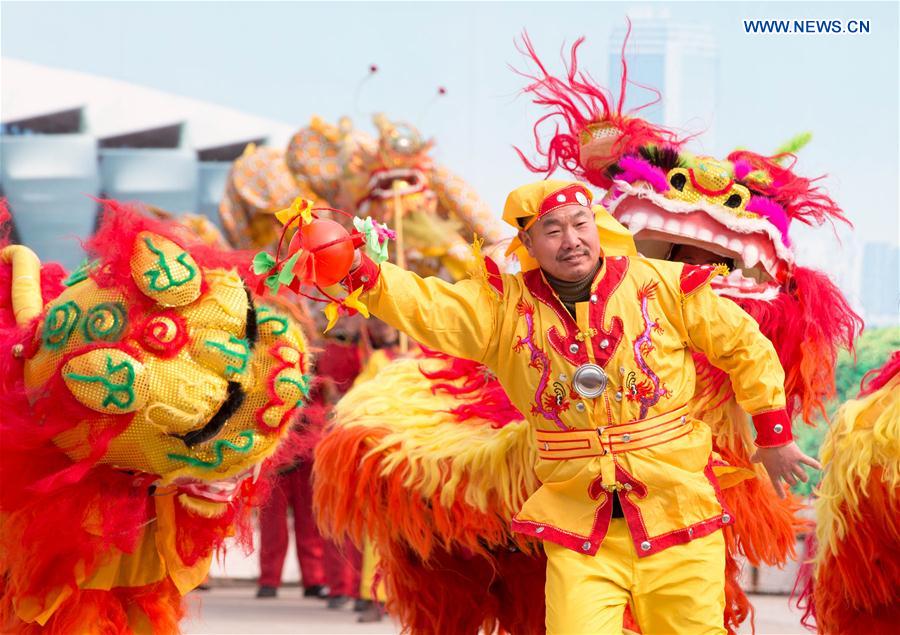 People perform at a square in Xuyi County, east China's Jiangsu Province, Jan. 14, 2016. 