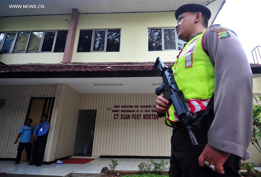 A police officer stands guard in front of the mortuary at the Police hospital in Jakarta, Indonesia, Jan. 19, 2016. 