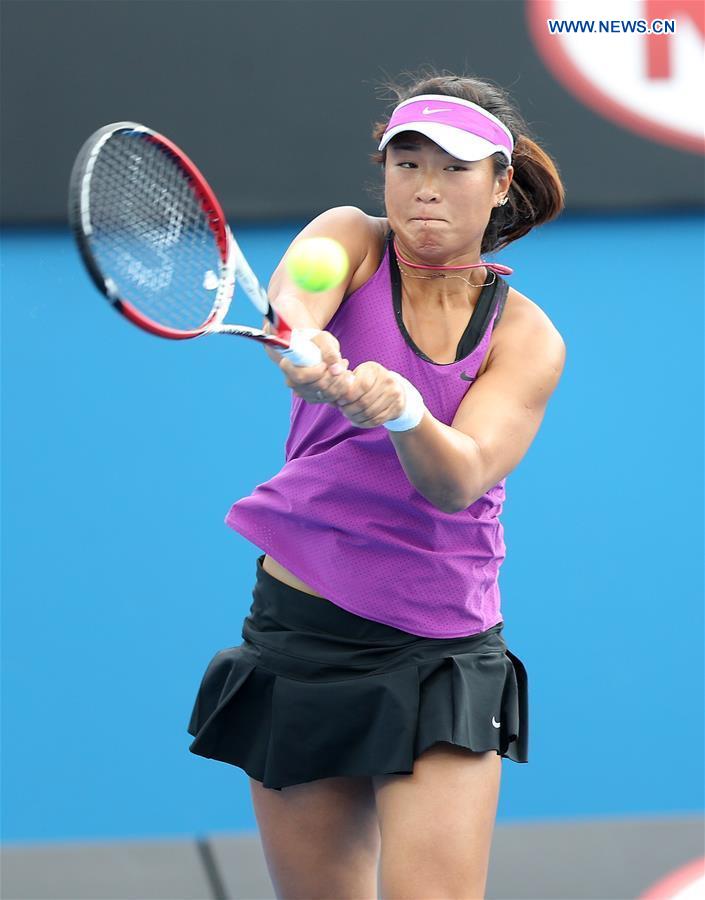 China's Han Xinyun competes with Kazakhstan's Yulia Putintseva during the second round match of women's singles at the Australian Open Tennis Championshis in Melbourne, Australia, Jan. 20, 2016.