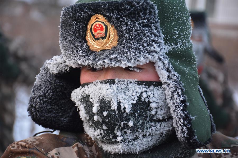 A frontier soldier takes part in a training under cold weather in Hulun Buir, north China's Inner Mongolia Autonomous Region, Jan. 19, 2016. 