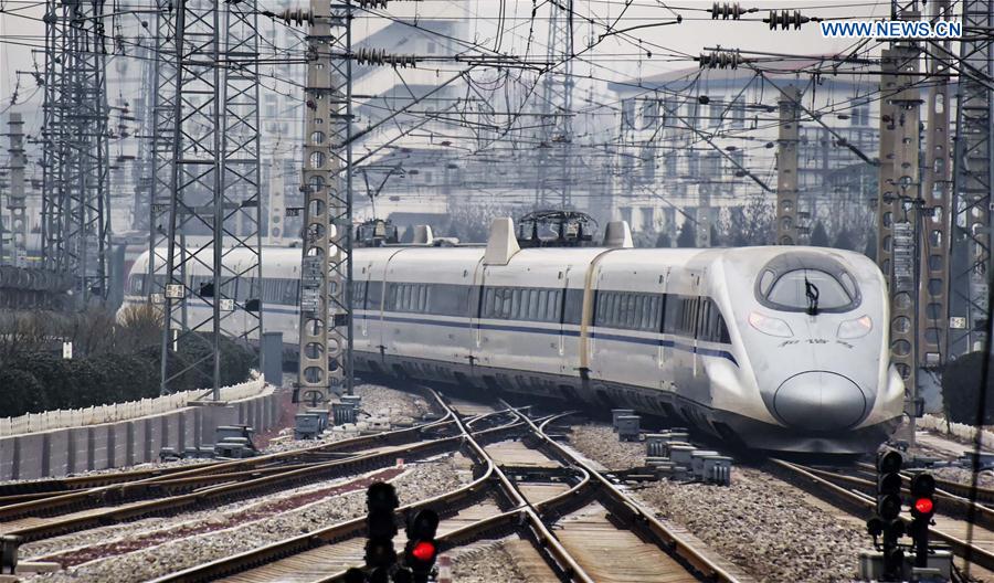 Photo taken on Jan. 21 2016 shows a CRH hight speed train departing from Beijing West Railway Station in Beijing, capital of China. 