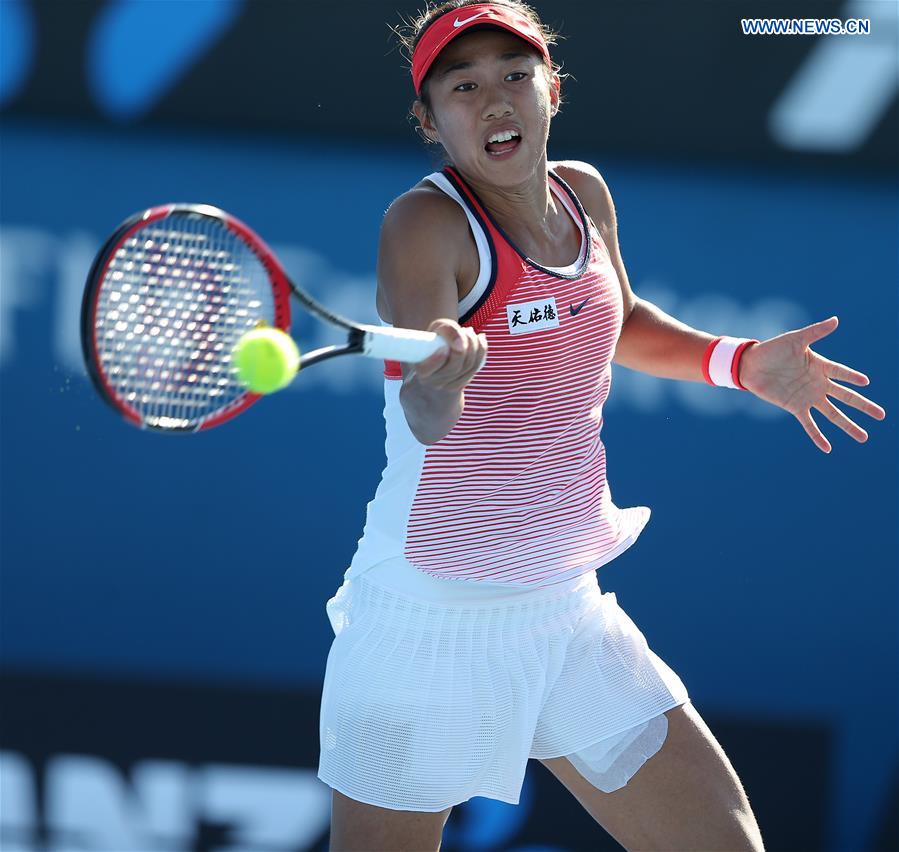 China's Zhang Shuai competes against Alize Cornet of France during the second round match of women's singles at the Australian Open Tennis Championships in Melbourne, Australia, Jan. 21, 2016. 