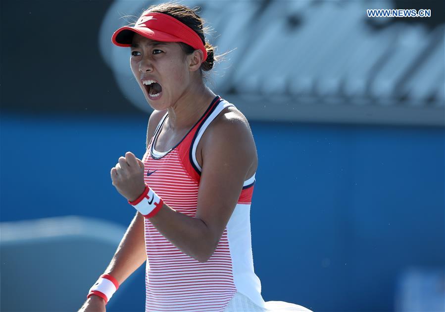 China's Zhang Shuai competes against Alize Cornet of France during the second round match of women's singles at the Australian Open Tennis Championships in Melbourne, Australia, Jan. 21, 2016. 