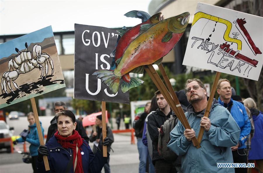 Local residents participate in a rally in Vancouver, Canada, Jan. 23, 2016. Hundreds of people staged a protest against the pipeline expansion in British Columbia. 