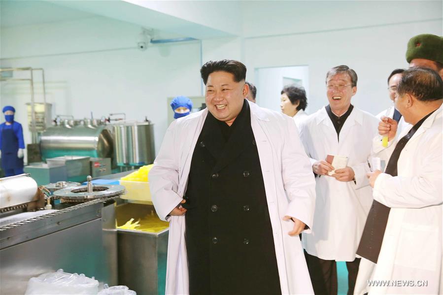 Photo provided by Korean Central News Agency (KCNA) on Jan. 23, 2016 shows top leader of the Democratic People's Republic of Korea (DPRK) Kim Jong Un (C) recently visiting the Kumkop General Foodstuff Factory for Sportsmen