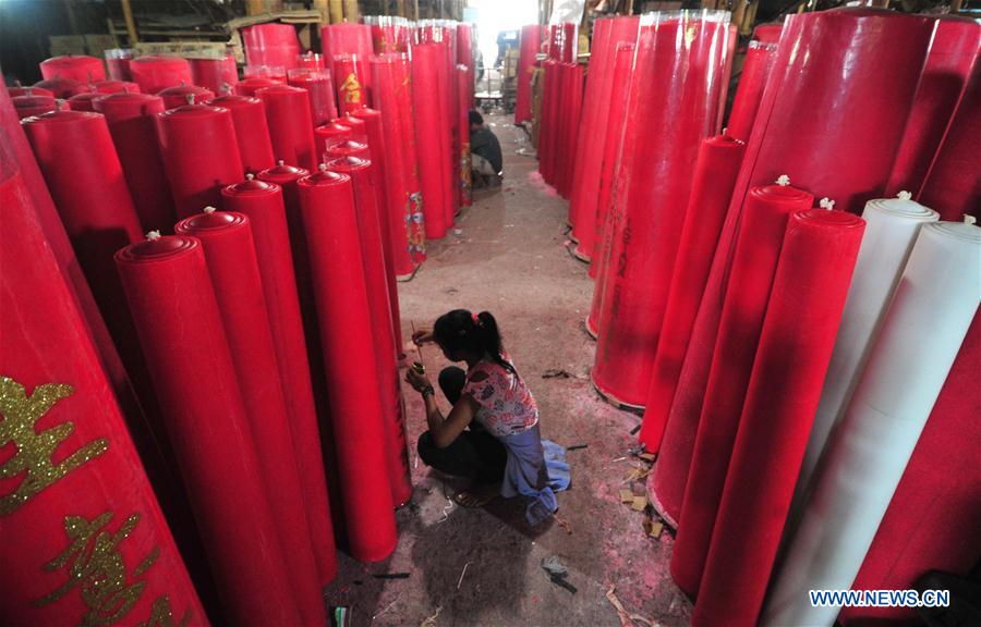 A worker makes candles for the upcoming Chinese Lunar New Year at a traditional candle workshop in Tangerang, Indonesia, Jan. 26, 2016. 