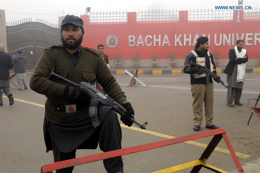 Pakistani policemen stand guard outside the Bacha Khan University in Charsadda, northwest Pakistan, Jan. 25, 2016. 