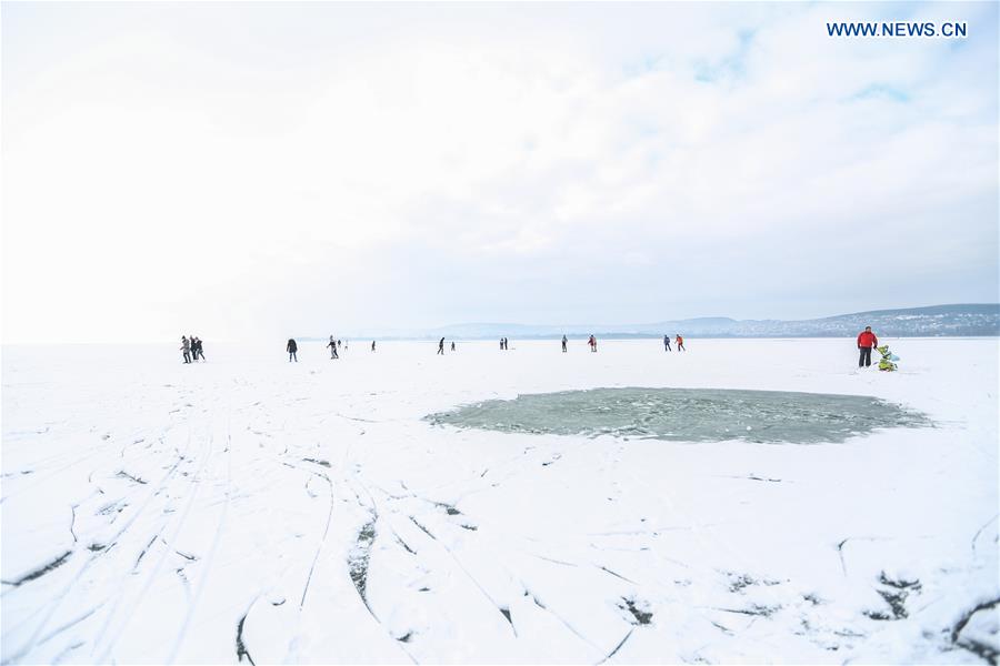 People enjoy winter on the frozen Lake Balaton in western Hungary, on Jan. 25, 2016. 