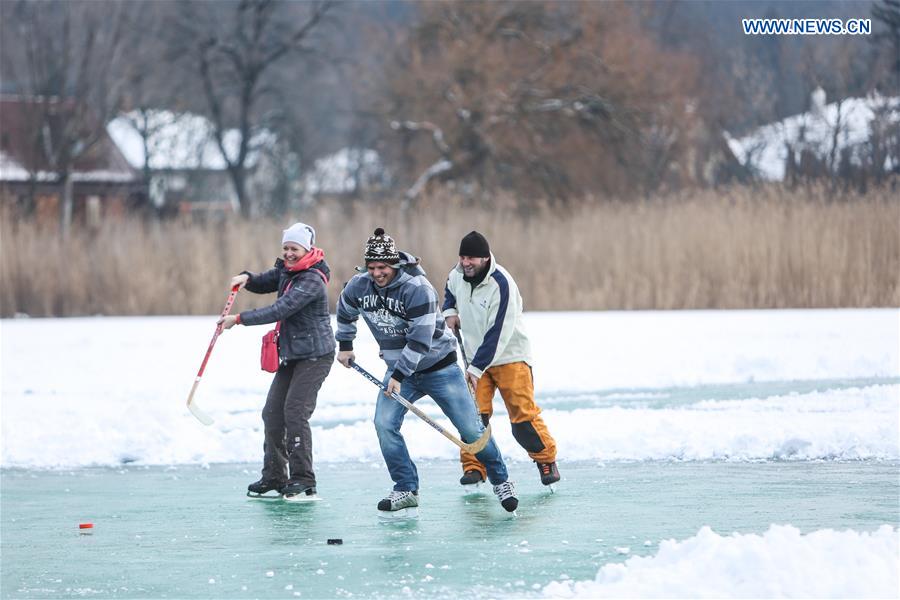 People play ice hockey on the frozen Lake Balaton in western Hungary, on Jan. 25, 2016.