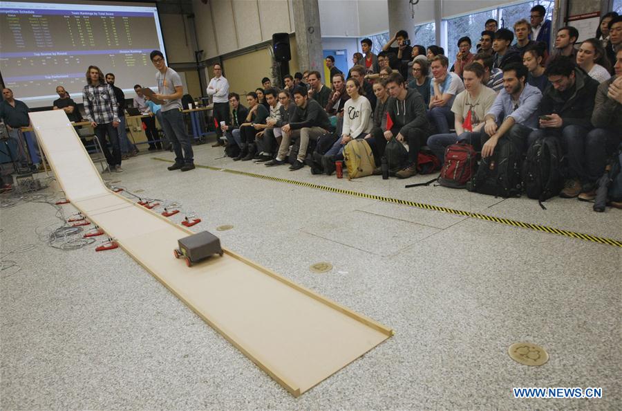 Students gather to watch a competition of robotic vehicles at the University of British Columbia in Vancouver, Cananda, Jan. 27, 2016. 