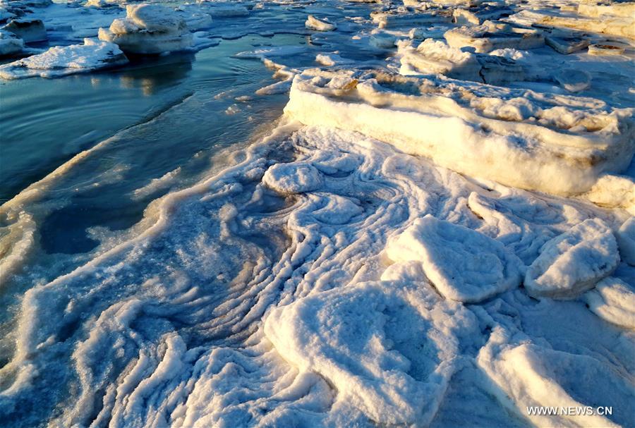 Due to a strong cold front, sea ice appeared along the seaside at Bohai Sea coast in Qinhuangdao.