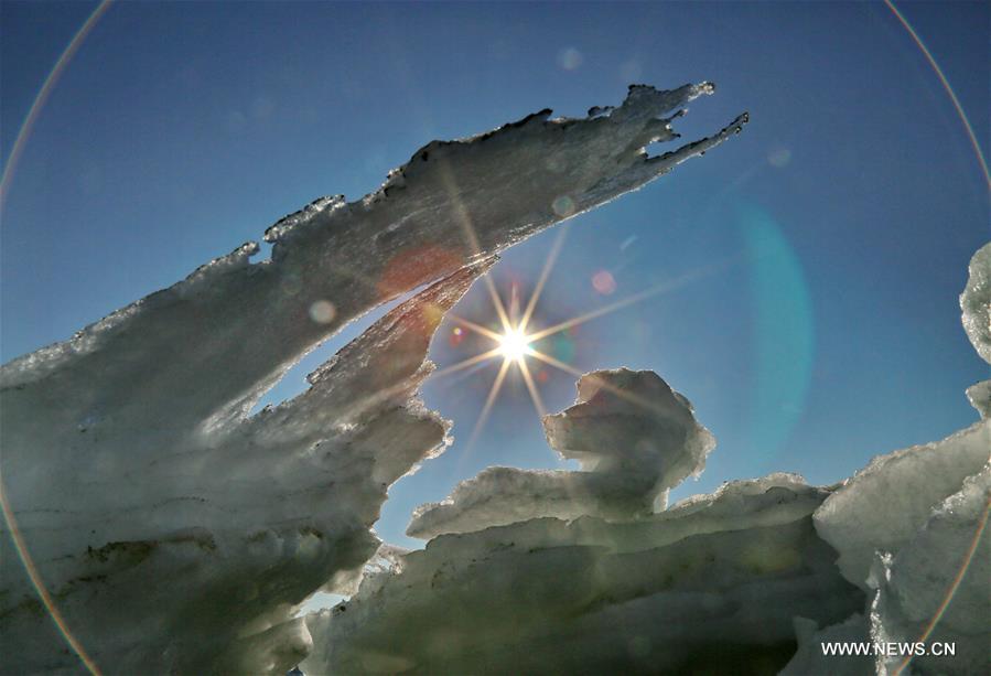 Due to a strong cold front, sea ice appeared along the seaside at Bohai Sea coast in Qinhuangdao.