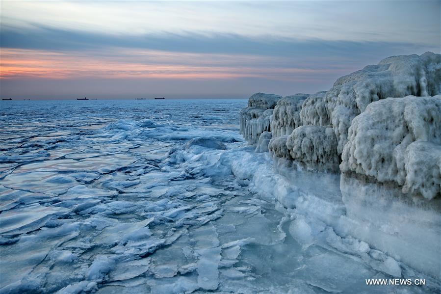 Due to a strong cold front, sea ice appeared along the seaside at Bohai Sea coast in Qinhuangdao.