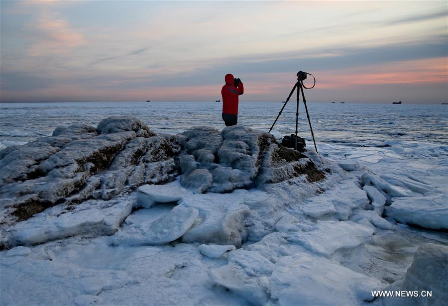 Due to a strong cold front, sea ice appeared along the seaside at Bohai Sea coast in Qinhuangdao.