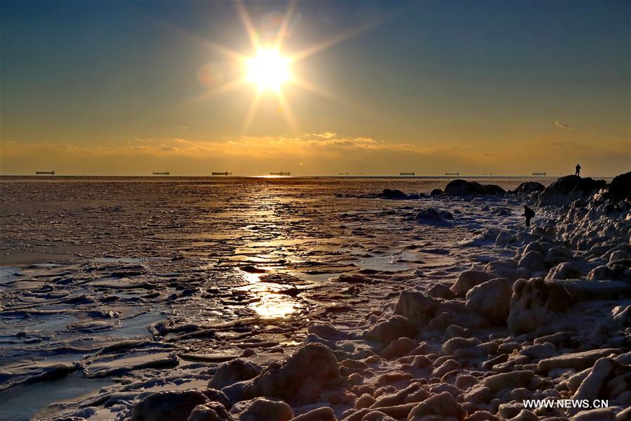Due to a strong cold front, sea ice appeared along the seaside at Bohai Sea coast in Qinhuangdao.