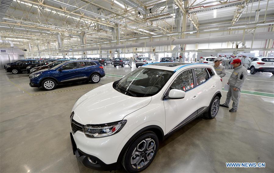 Workers are busy on a production line at Dongfeng-Renault plant in Wuhan, China's auto hub in the central province of Hubei, Feb. 1, 2016.