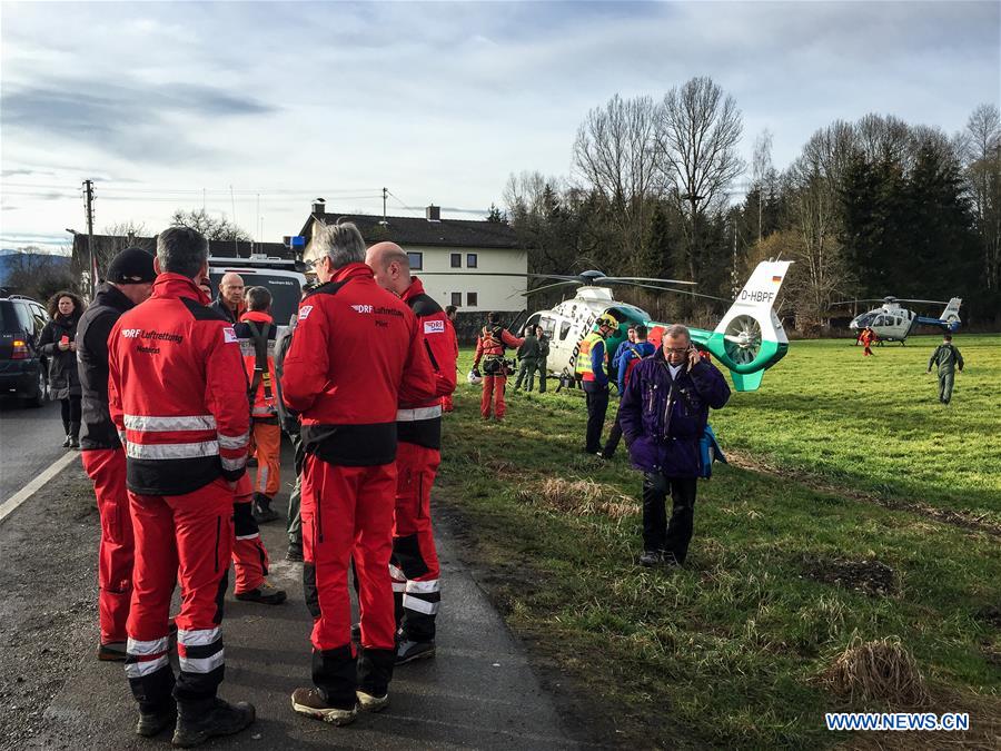 Rescuers are seen at the accident site in Bad Aibling, Germany, on Feb. 9, 2016. 