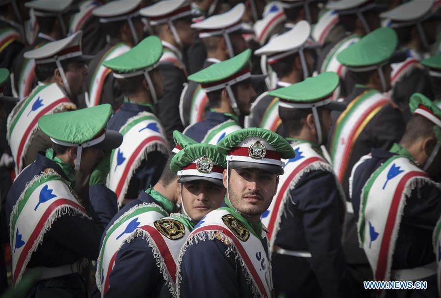 Iranian schoolgirls attend a rally to mark the 37th anniversary of the Islamic revolution at Azadi (liberty) Square in Tehran, Iran, Feb. 11, 2016.