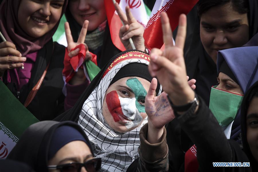 Iranian schoolgirls attend a rally to mark the 37th anniversary of the Islamic revolution at Azadi (liberty) Square in Tehran, Iran, Feb. 11, 2016.