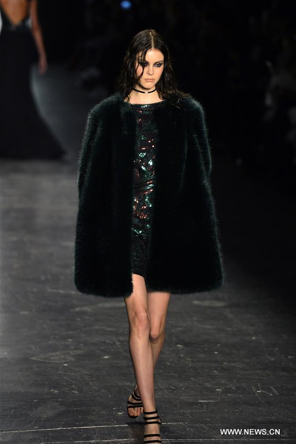 Models present creations of the Fall/Winter 2016 Tadashi Shoji collection during the New York Fashion Week in New York, the United States, Feb. 12, 2016