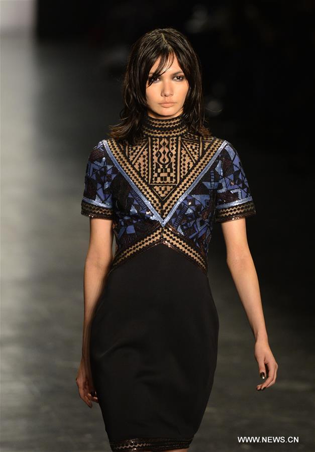 Models present creations of the Fall/Winter 2016 Tadashi Shoji collection during the New York Fashion Week in New York, the United States, Feb. 12, 2016